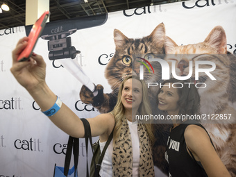 Sara and Amy Sheptycki take a selfie at CatCon, a convention for cat lovers in Pasadena, California on August 12, 2017. The two-day event in...