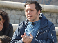 Cenk Yigiter, a former academic of Ankara University who was sacked by a decree-law of the state of emergency, speaks during an outdoor lect...