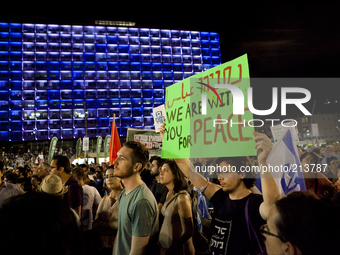 Israelis take part in a demonstration calling for negotiations between Israel and the Palestine on August 16, 2014 in Tel Aviv, Israel. Thou...