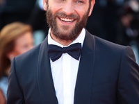 Alessandro Borghi walks the red carpet ahead of the 'Downsizing' screening and Opening Ceremony during the 74th Venice Film Festival at Sala...
