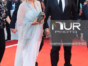 Ricky Tognazzi and Simona Izzo walks the red carpet ahead of the 'Downsizing' screening and Opening Ceremony during the 74th Venice Film Fes...