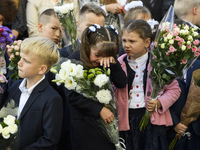 Schoolchildren attend a ceremony to mark the start of the school year in Kyiv, Ukraine September 1, 2017. (