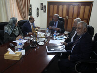 Ministers of the Palestinian unity government in Gaza strip attend a meeting in Gaza city, on August 19, 2014. (