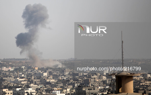 Smoke is seen after what witnesses said was an Israeli air strike in Gaza City August 19, 2014. Israel launched attacks in the Gaza Strip on...