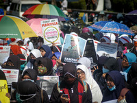 Indonesian Muslims hold banners and shout slogans during a protest in Semarang, Central Java Province, Indonesia on September 08, 2017, con...