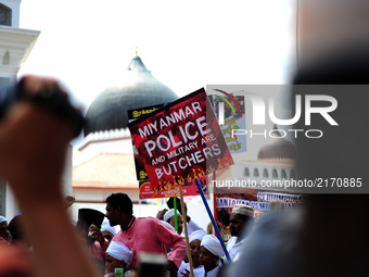 Demonstrator's holds banners during a protest of the genocide of Ethnic Rohingya Muslims in Myanmar, in George Town, Penang on September 8,...