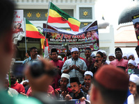 An NGO representative prays during a protest of the genocide of Ethnic Rohingya Muslims in Myanmar, in George Town, Penang on September 8, 2...
