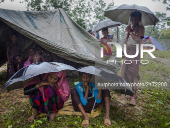 Rohingya ethnic minority people waiting at a temporary makeshift camp after crossing over from Myanmar into the Bangladesh side of the borde...