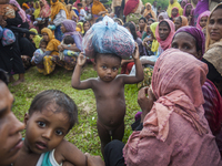 Rohingya ethnic minority people waiting for relief at a temporary makeshift camp after crossing over from Myanmar into the Bangladesh side o...