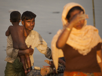 Rohingya ethnic minority family  looking for temporary makeshift camp after crossing over from Myanmar into the Bangladesh side of the borde...