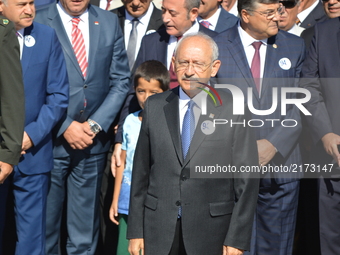 The main opposition Republican People's Party (CHP) leader Kemal Kilicdaroglu (C) attends a march marking the 94th anniversary of his party...