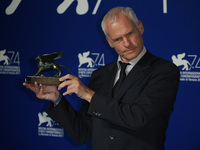Martin McDonagh receives the Best Screenplay Award for 'Three Billboards Outside Ebbing, Missouri' during the Award photocall of the 74th Ve...