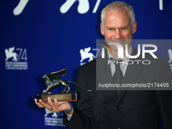 Martin McDonagh receives the Best Screenplay Award for 'Three Billboards Outside Ebbing, Missouri' during the Award photocall of the 74th Ve...