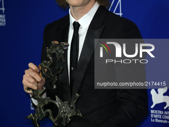 Charlie Plummer poses with the 'Marcello Mastroianni' Award for Best New Young Actor or Actress for 'Lean On Pete' at the Award Winners phot...