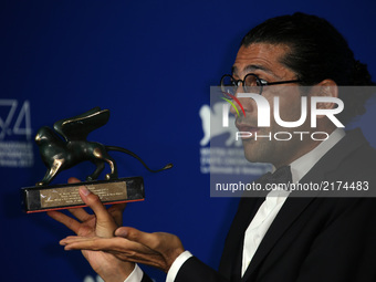 Alireza Khatam poses with the Orizzonti Award for Best Screenplay Award for 'Los Versos Del Olvido' (Oblivion Verses) at the Award Winners p...