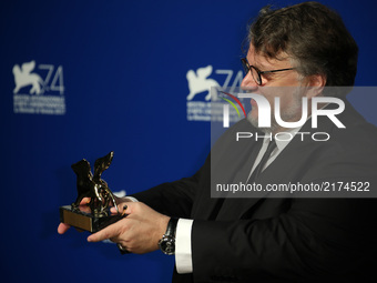 Guillermo del Toro poses with the Golden Lion for Best Film Award for 'The Shape Of Water' at the Award Winners photocall during the 74th Ve...