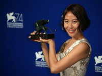  Gina Kim poses with the Best VR Experience Award for 'La Camera Insabbiata' co-directed with Laurie Anderson at the Award Winners photocall...