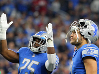 Detroit Lions running back Theo Riddick (25)  and Detroit Lions quarterback Matthew Stafford (9) react to the official's ruling on Riddick's...