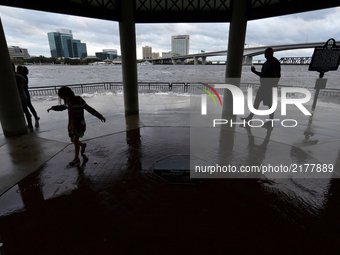 People walk around Riverwalk Brooklyn, Jacksonville after flood water resides from parts of Jacksonville, FL after Hurricane Irma took an un...