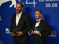 Venice, Italy. 09 September, 2017. Xavier Legrand (R) and Alexandre Gavras pose with the Silver Lion for Best Director Award for 'Jusqu' la...