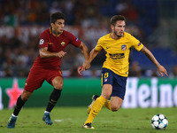 Diego Perotti of Roma and Saul Niguez of Atletico during the UEFA Champions League Group C football match between AS Roma and Atletico Madri...