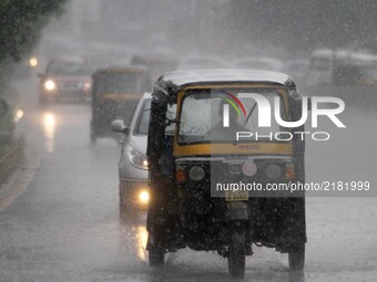 Heavy traffic during a sudden downpour time in the eastern Indian state Odisha's capital city Bhubaneswar on 13 September 2017. (