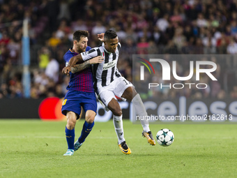 Lionel Messi and Alex Sandro during the match between FC Barcelona - Juventus, for the group stage, round 1 of the Champions League, held at...