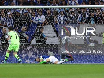 Besiktas' midfielder Talisca (R) score a goal during the FC Porto v Besiktas - UEFA Champions League Group G round one match at Dragao Stadi...