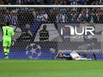 Besiktas' midfielder Talisca (R) score a goal during the FC Porto v Besiktas - UEFA Champions League Group G round one match at Dragao Stadi...