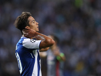 Porto's Spanish midfielder Oliver Torres reacts during the FC Porto v Besiktas - UEFA Champions League Group G round one match at Dragao Sta...