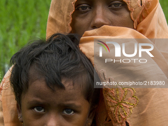 A Rohingya Muslim refugee woman with her child in Kutupalong, Bangladesh, on September 9, 2017. International divisions emerged on September...