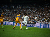 Marcelo of Real Madrid  runs with the ball during a Champions League group H soccer match between Real Madrid and Apoel Nikosia at the Santi...