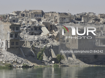 The old city of West Mosul across the Tigris by the old bridge. The neighbourhood is largely destroyed, but efforts are made to repair the o...