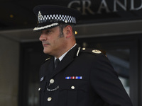 Police commander Stuart Cundy is seen while he leaves after attending the opening statements of the Inquiry into the Grenfell Tower fire dis...