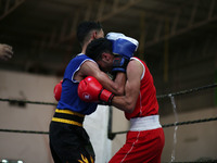 Palestinian competitors participate in the first Boxing Championship in Gaza City organized by the Palestinian Olympic Committee, on Septemb...
