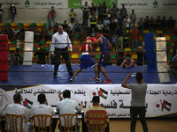 Palestinian competitors participate in the first Boxing Championship in Gaza City organized by the Palestinian Olympic Committee, on Septemb...