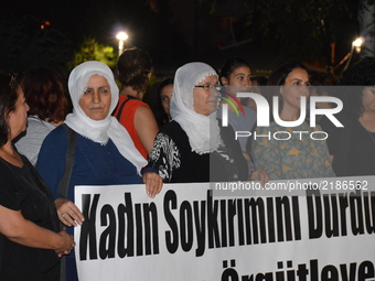 Female supporters of Turkey's pro-Kurdish Peoples' Democratic Party (HDP) hold a banner during a protest in support of women, who are facing...
