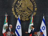 Israeli Prime Minister Benjamin Netanyahu speaks with Mexico's President Enrique Pena Nieto during a press conference at Los Pinos president...
