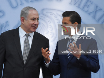 Israeli Prime Minister Benjamin Netanyahu speaks with Mexico's President Enrique Pena Nieto during a press conference at Los Pinos president...
