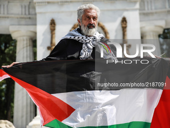 demonstrators are seen hold flags of Palestine during a protest against the visit of Israeli Prime Minister Benjamín Netanyahu held at Hemic...