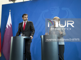 German Chancellor Angela Merkel and Emir of Qatar Sheikh Tamim bin Hamad Al Thani are pictured during a news conference at the Chancellery i...