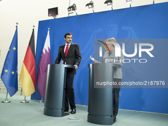 German Chancellor Angela Merkel and Emir of Qatar Sheikh Tamim bin Hamad Al Thani are pictured during a news conference at the Chancellery i...
