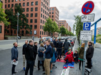 Activists sit on blankets in a parking lot and talk in Berlin, Germany, on 15 September 2017. In the annual worldwide action, artists, desig...