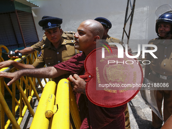 A Sri Lankan Buddhist activist monk who support  Myanmar's Buddhist community and  Myanmar's  leader Aung San Suu Kyi, walks through barrica...