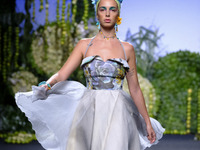 A model takes to the catwalk with a creation for Spring-Autunm 2018 Collection of  Francis Montesinos during the first day of the Madrid Fas...