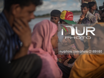 Rohingya refugees are crossing river by boat, Shahpirer Dip, Teknaf, Bangladesh; September 14, 2017. Bangladesh will use troops to deliver f...
