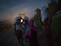 Rohingya refugees are returning to the Balukhali refugee camp after collecting relief. Chittagong, Bangladesh. September 15, 2017.  Banglade...