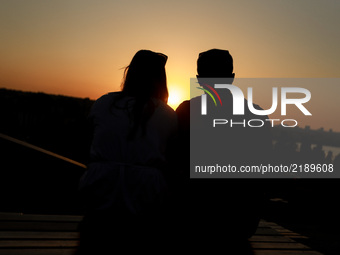 A couple watches the sunset in Istanbul on Turkey 16 September, 2017 (