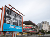An election poster of the populist right-wing Alternative fuer Deutschland (Alternative for Germany, AfD) party reading 'stop islamization'...