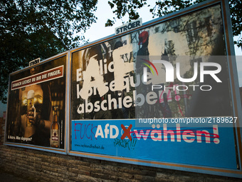 A vandalized election poster of the populist right-wing Alternative fuer Deutschland (Alternative for Germany, AfD) party reading 'vote AfD'...